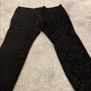 Black pants with patterns.